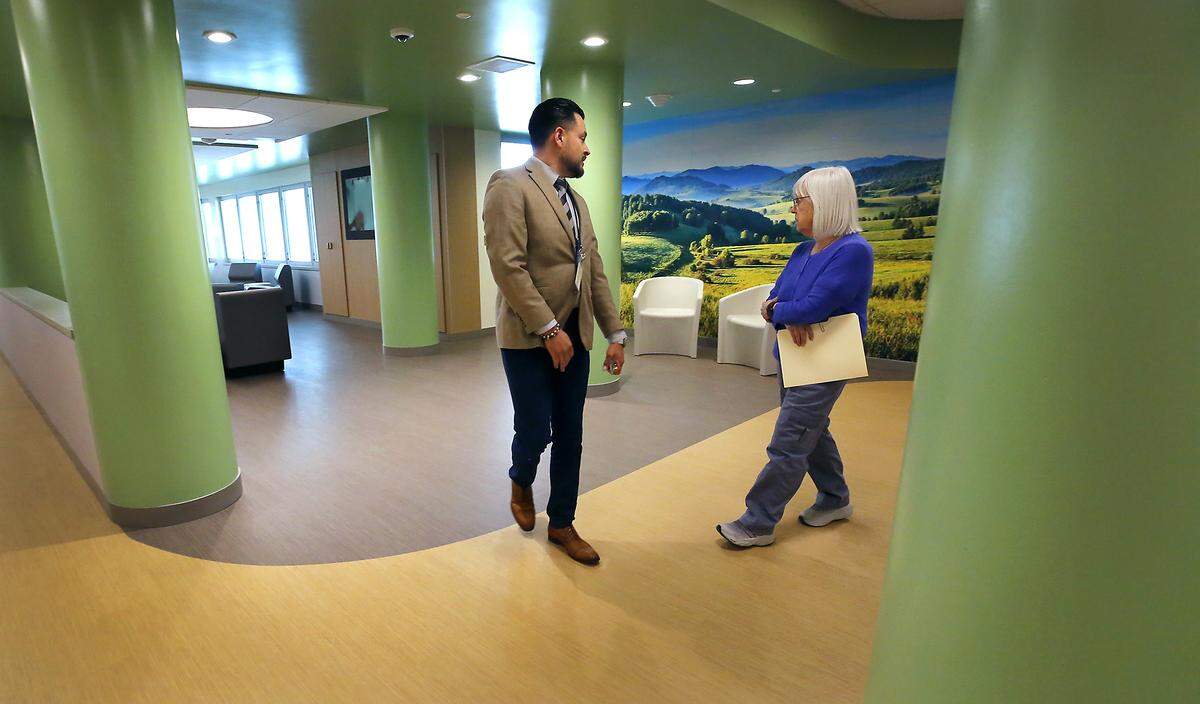 Jose Lopez of Comprehensive Healthcare leads Sen. Patty Murray, D-Wash, on a tour of the new Columbia Valley Center for Recovery.